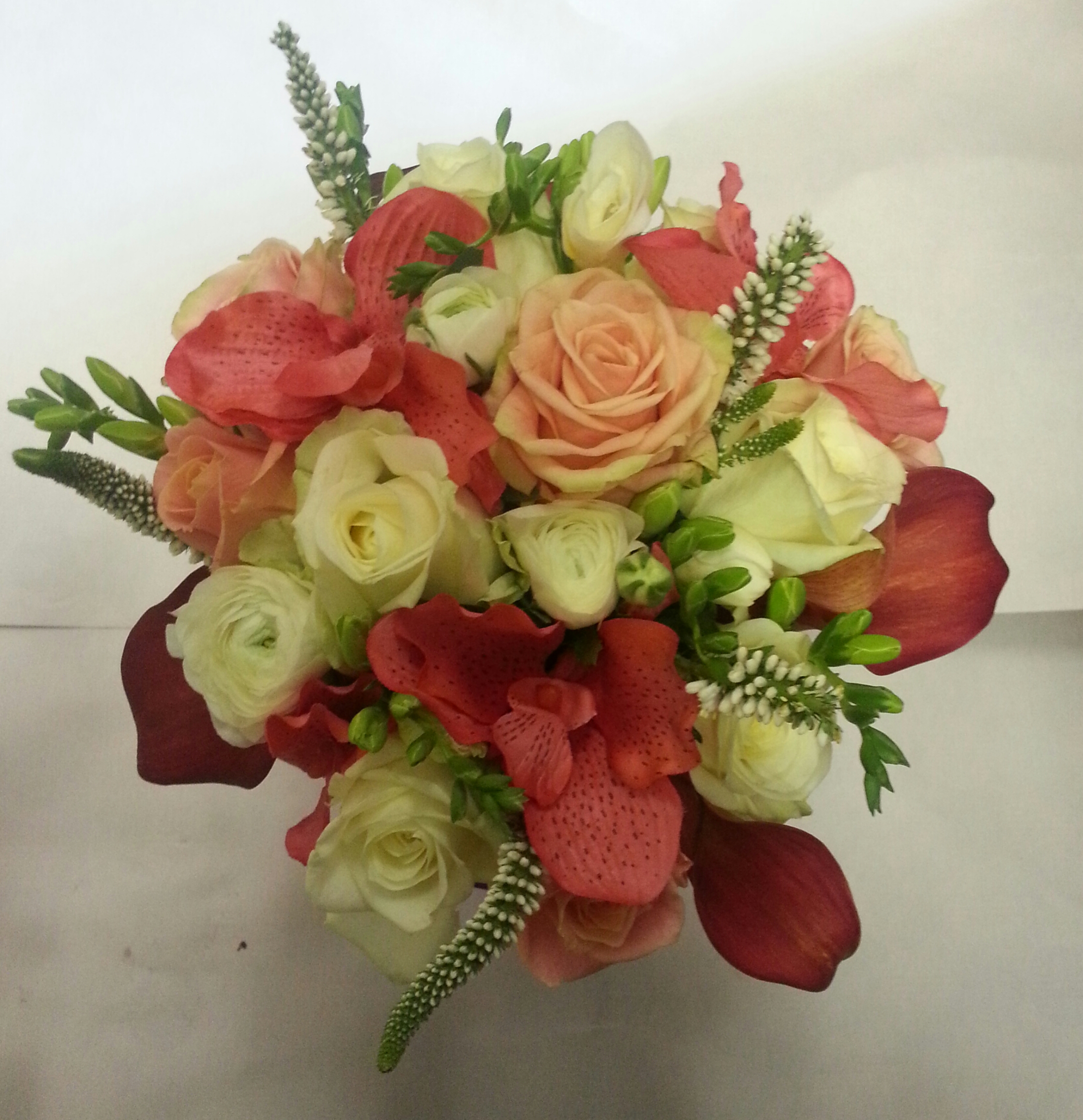 Eileen Jenkins coral and ivory bridesmaids bouquet