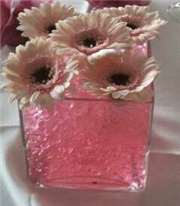 Cube venue table displays with gerbera