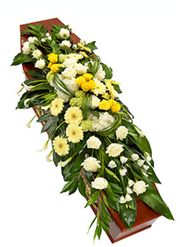 yellow and white casket spray