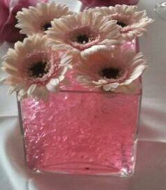 Eileen Jenkins Cube venue table displays with gerbera